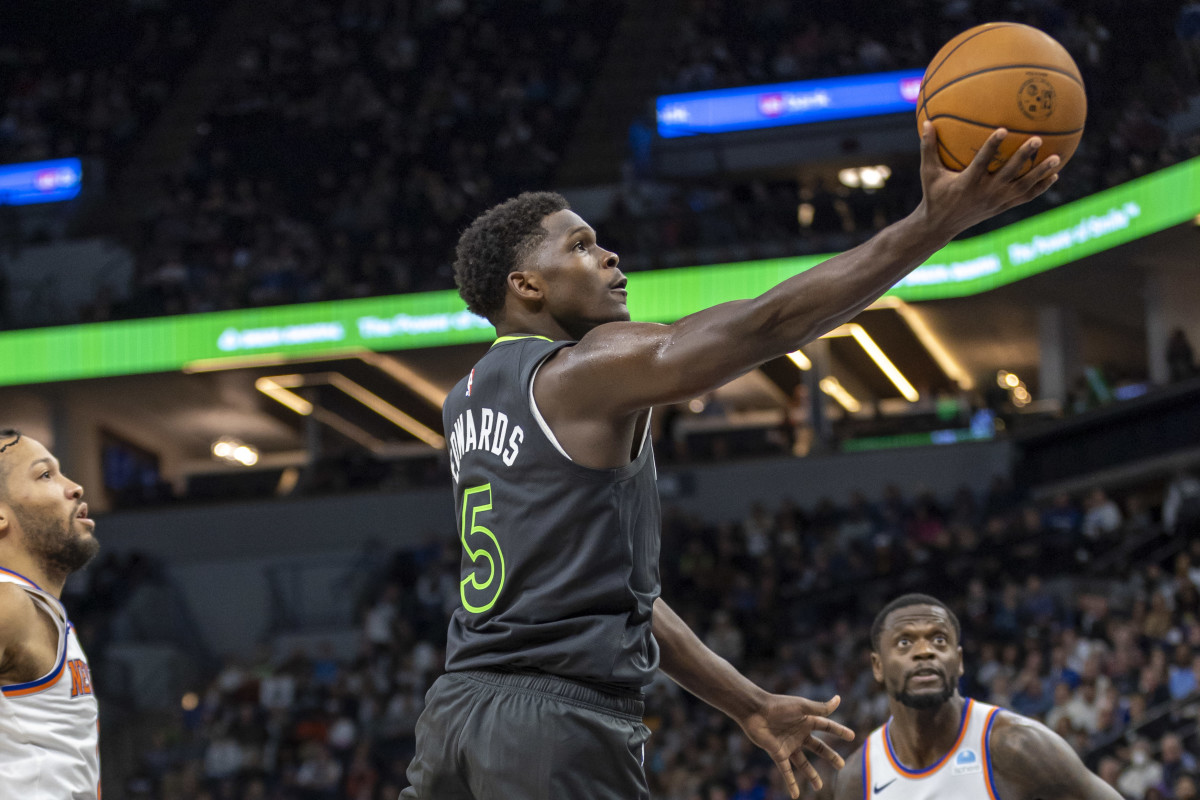 Nov 20, 2023; Minneapolis, Minnesota, USA; Minnesota Timberwolves guard Anthony Edwards (5) shoots against the New York Knicks in the second half at Target Center.